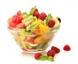 Business setting - fresh fruits salad in bowl  and berries