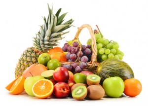 exercise and carbs - Variety of fruits in wicker basket isolated on white