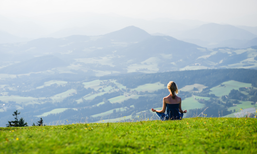 More progress with meditation - Young woman meditating outdoors